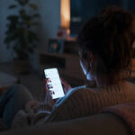 oomscrolling | woman scrolling social media on a smartphone
